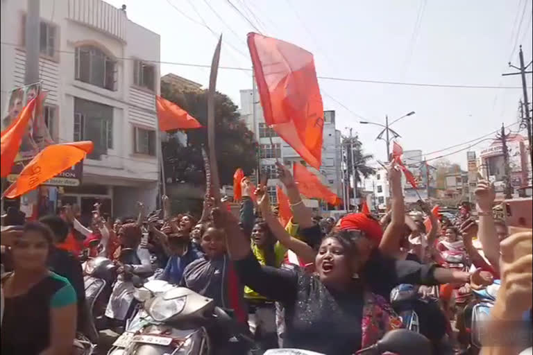 Young women wave the sword