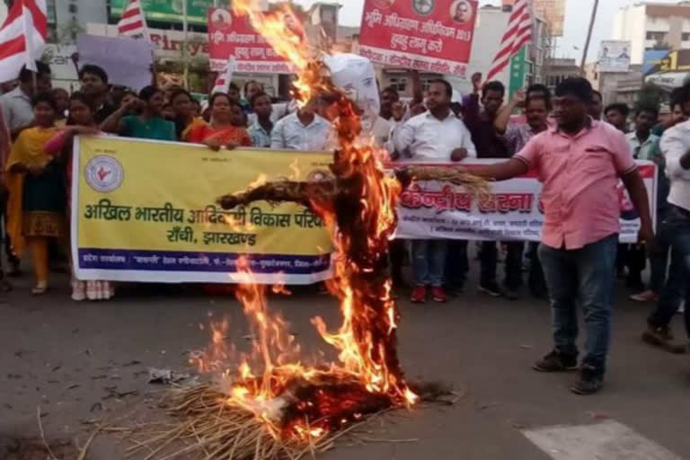 The tribals burnt effigies of Sameer Oraon and Babulal Marandi in ranchi