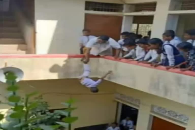 Principal hangs kid upside down from building in UP