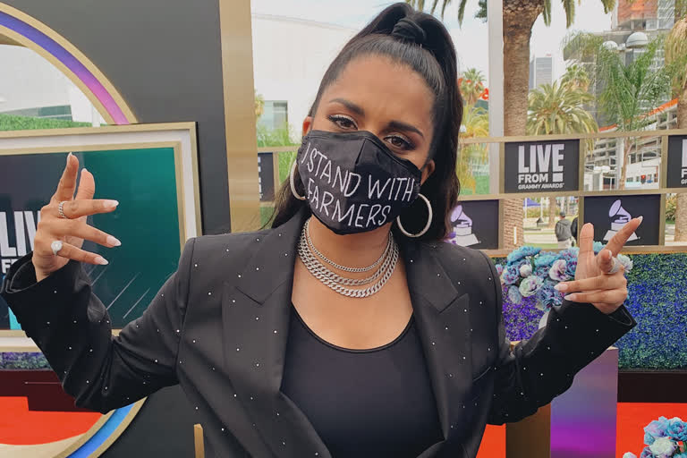 Lilly Singh wears I Stand With Farmers mask to Grammys red carpet