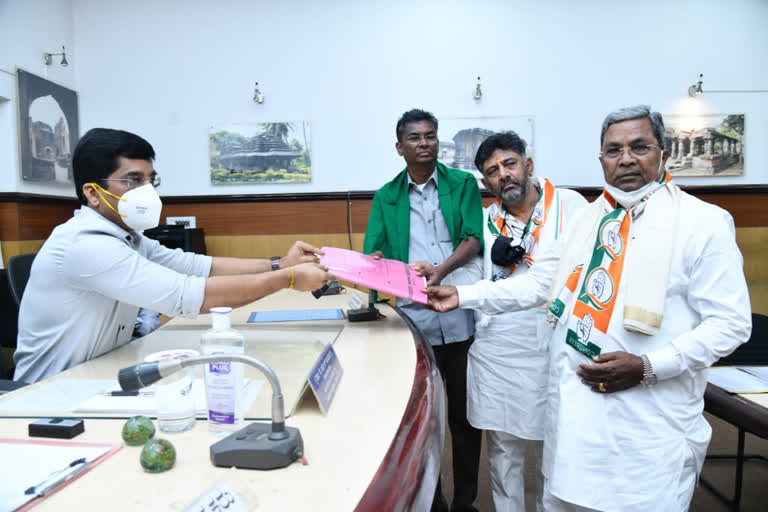 sathish jarkiholi nomination files with dks and siddaramaiah