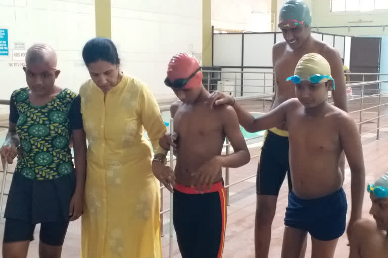 Specially abled students won medals in swimming competition