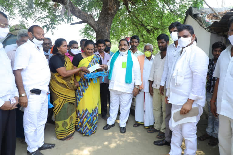 sathupalli mla sandra venkata veeraiah, cheques distribution