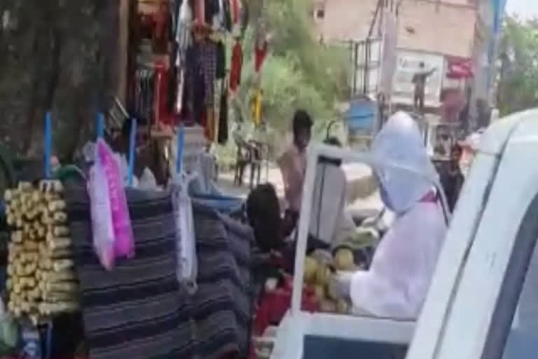 Health worker drinking juice on the way