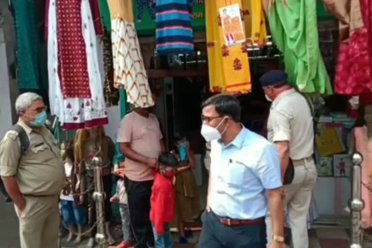 shops closed for not following corona guidelines in dhanbad