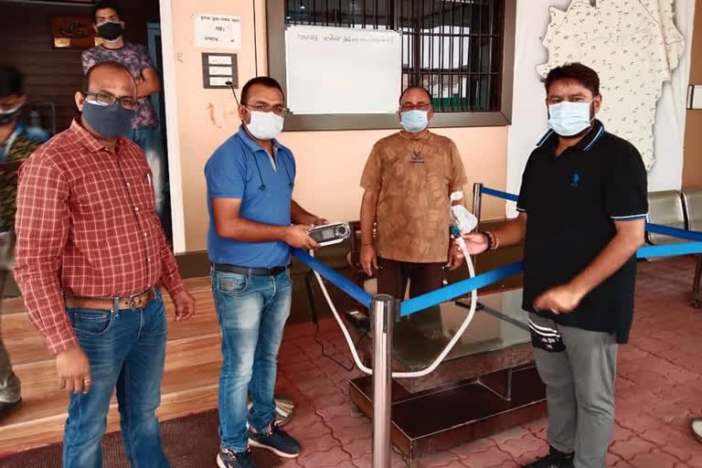 MLA Ashish Chhabra delivering ventilator machine