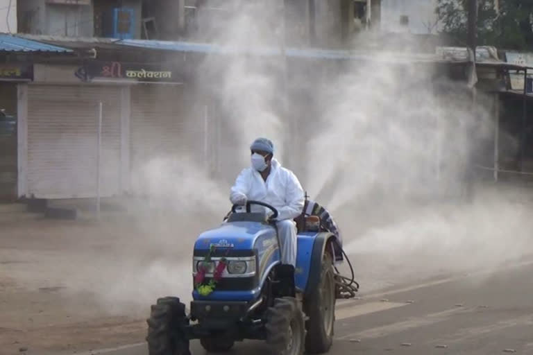 Socialist Yogesh Tiwari spraying sanitizer