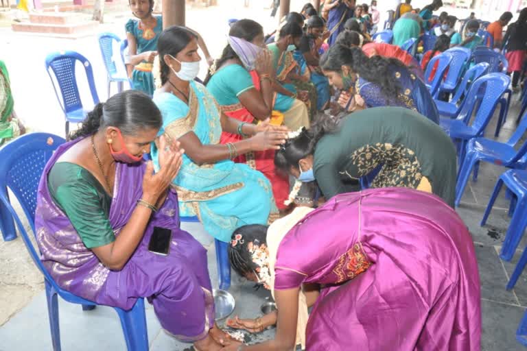 Students perform pada puja to their Father and Mother in kollegal, chamarajanagar district