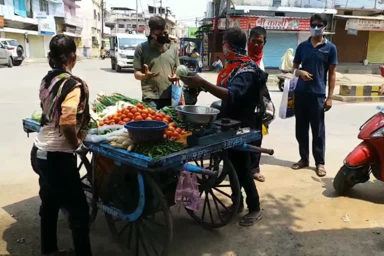 People shopping for vegetables