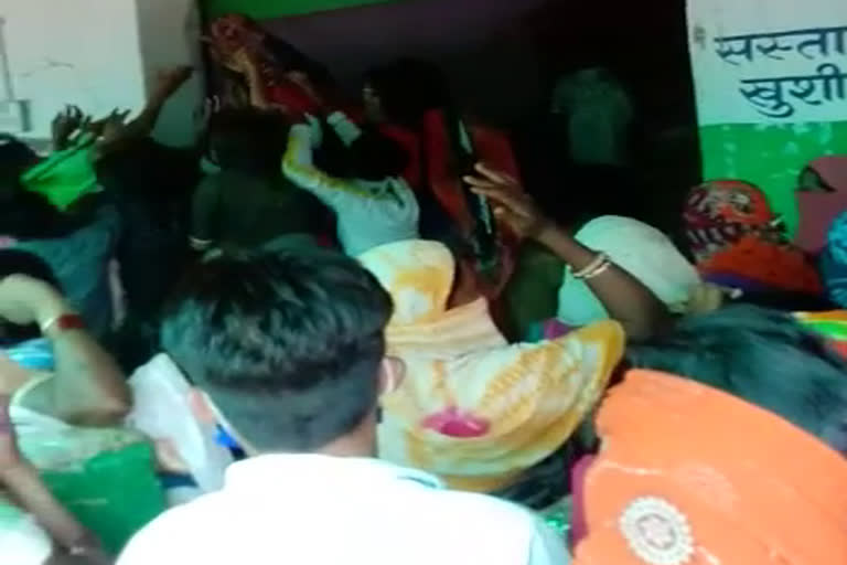 Crowd of people in ration shop of Gariyaband