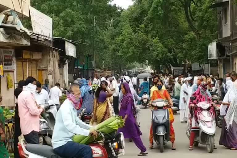 people crowd for buying groceries in bhandara