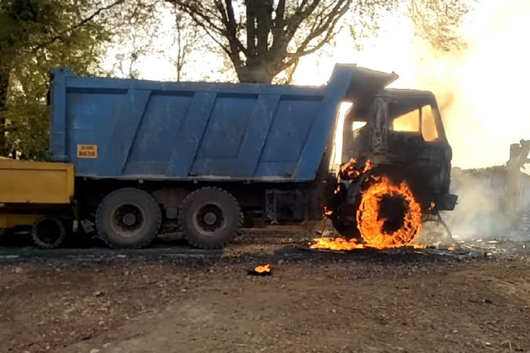 naxalites set fire to hyva engaged in road construction work in chaibasa