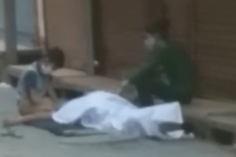 Father dead body lying on street