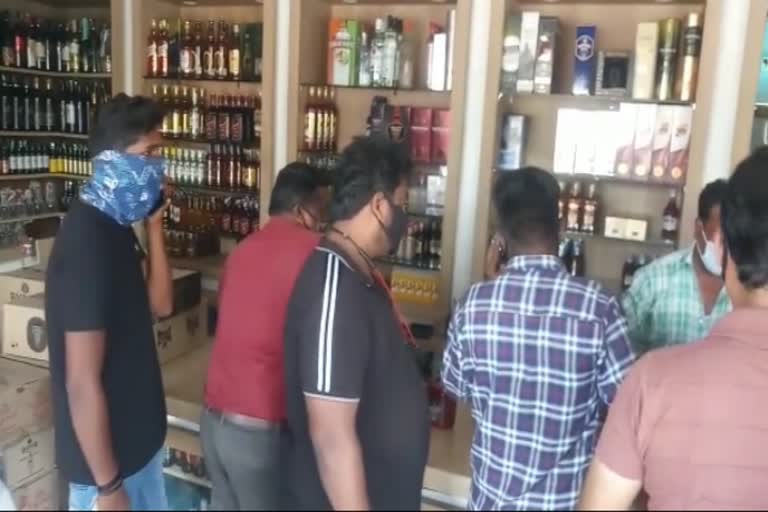 People buying liquor in Mysore