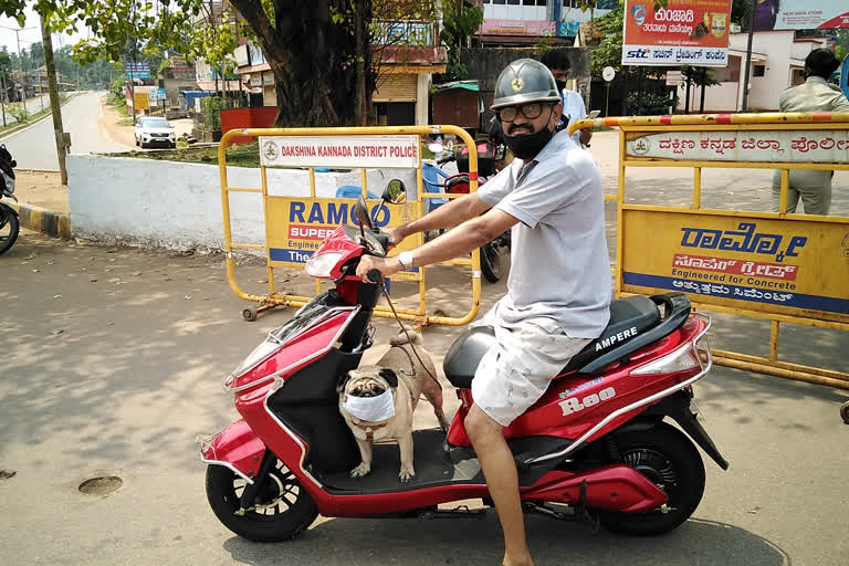 dog-travels-in-bike-wearing-mask-at-mangalore