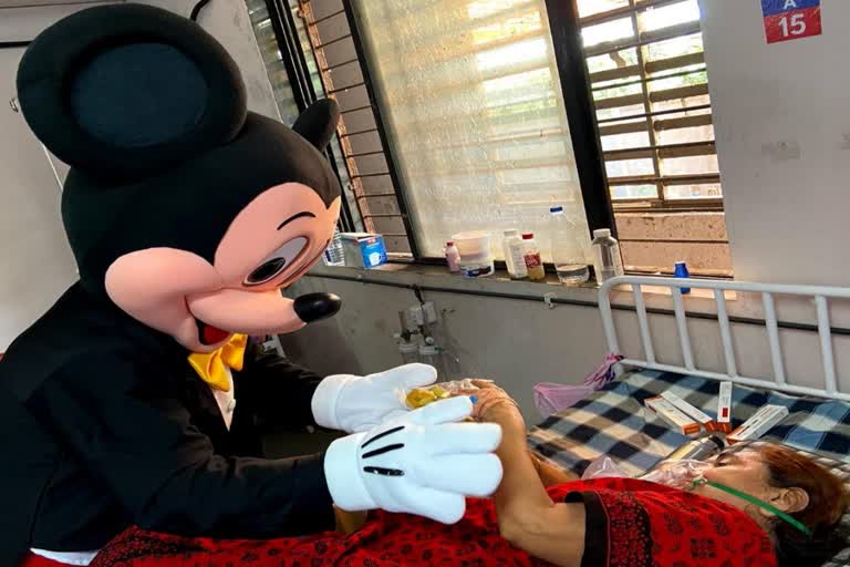 mickey and mouse from disney world arrive to meet corona patients in surat