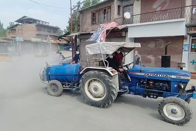 sanitizer spraying in market by municipal council ganderbal