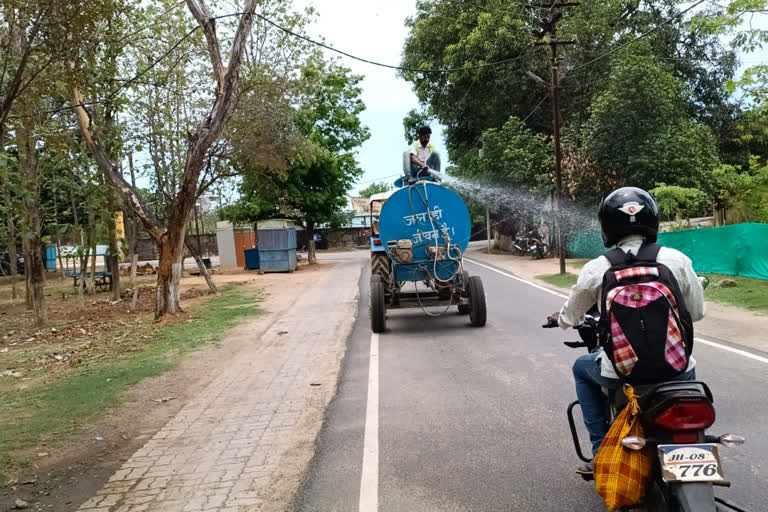 urban area is being sanitized by tanker in simdega