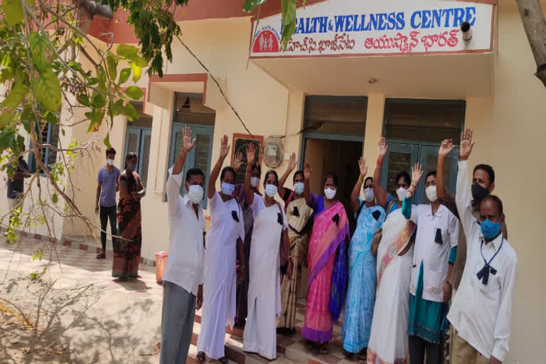 phc staff agitated with black badges at kadapa district