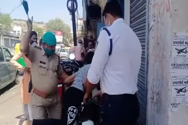 Police officer assaulting a young man