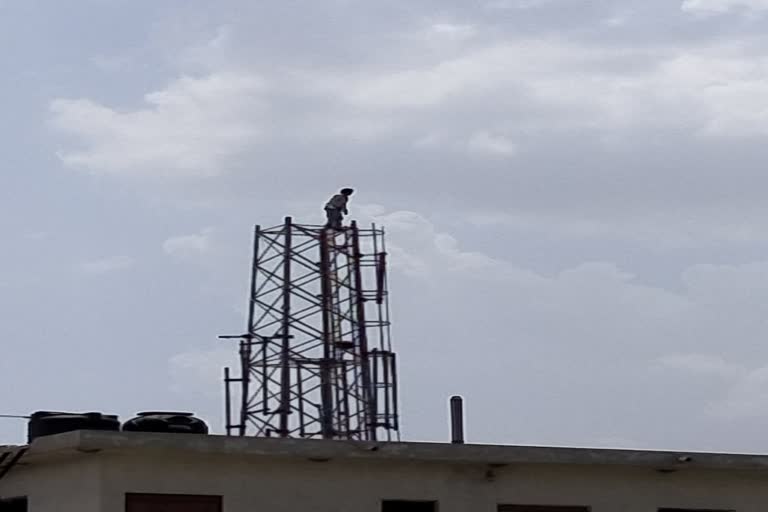 youth climb on tower in kota,  youth climb on tower