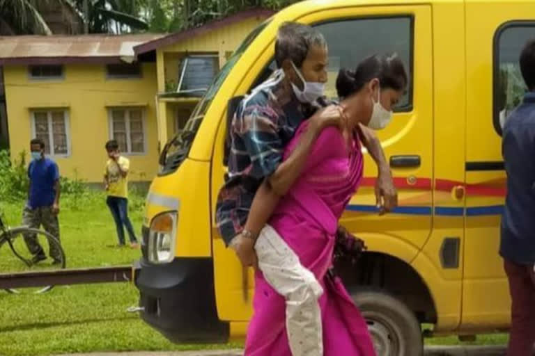 assam-woman-niharika-das-carries-covid-positive-father-in-law-on-shoulders