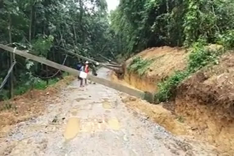 Power poles  fell on the road by rain