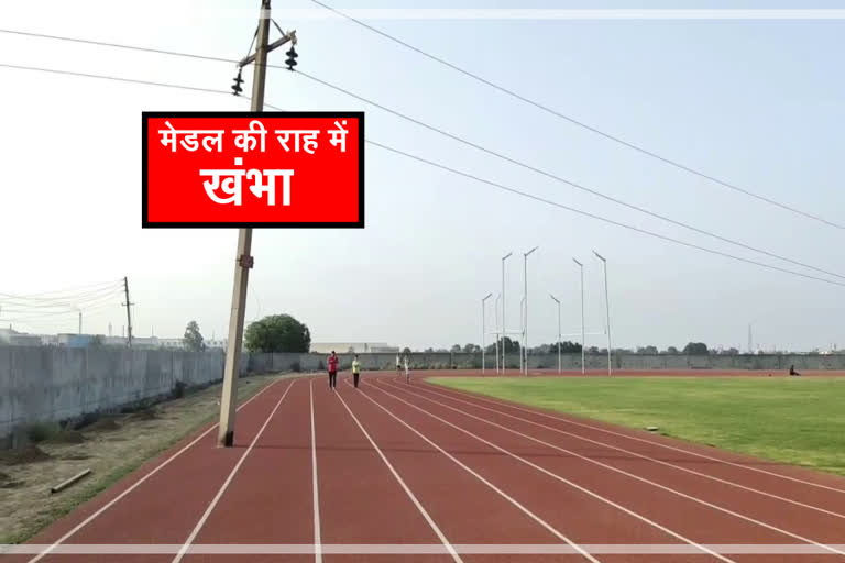 electric pole between racing track in panipat stadium