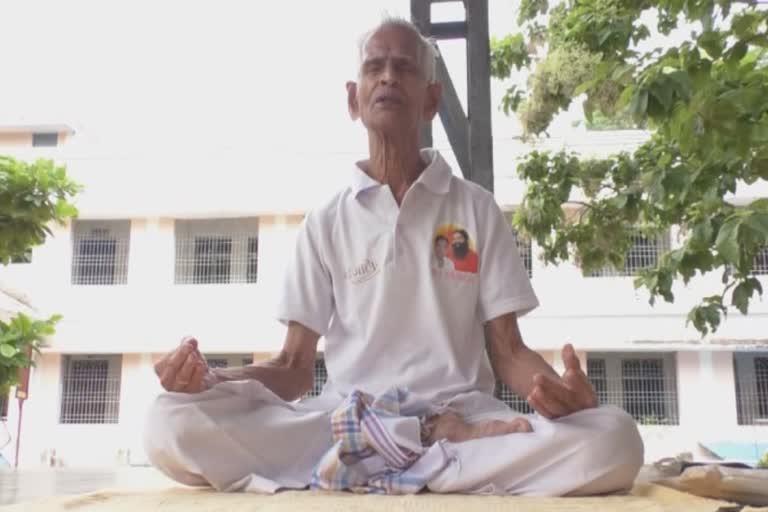 a 85 year old man gives free training of yoga to people in gajpati