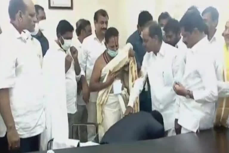 Siddipet collector touches KCR's feet