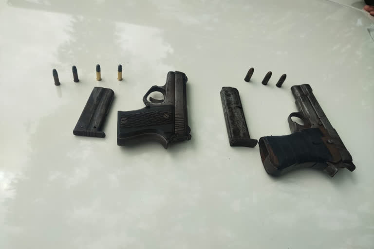 Two men arrested with weapons