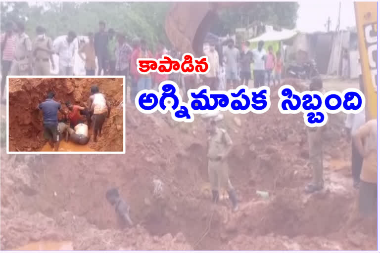 Firefighters rescue a worker stuck in 10 meter deep pit at vijayawada