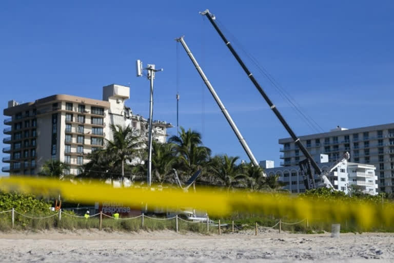 Demolition preparations begin at condo with storm looming