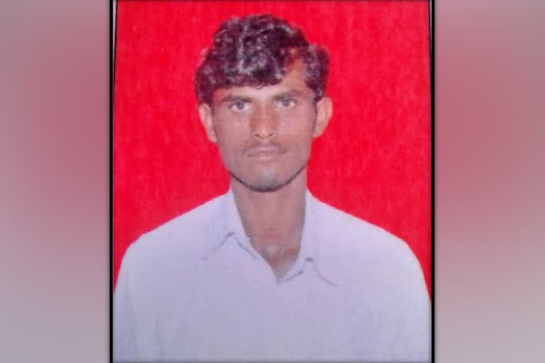 A youth washed away in rain water at Kalburgi