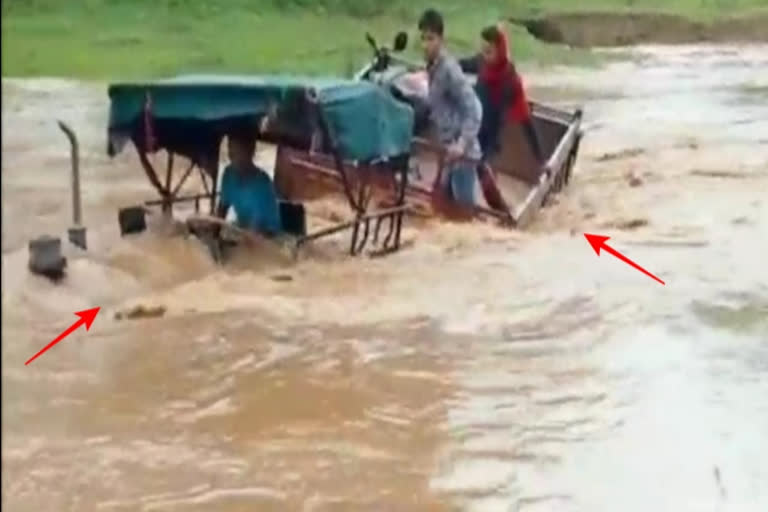 Tractor washed away in rain