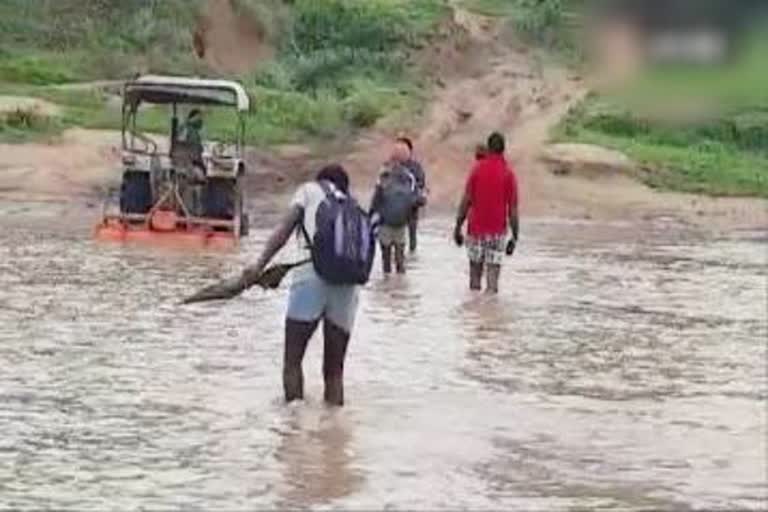 Villagers crossed overflowing river