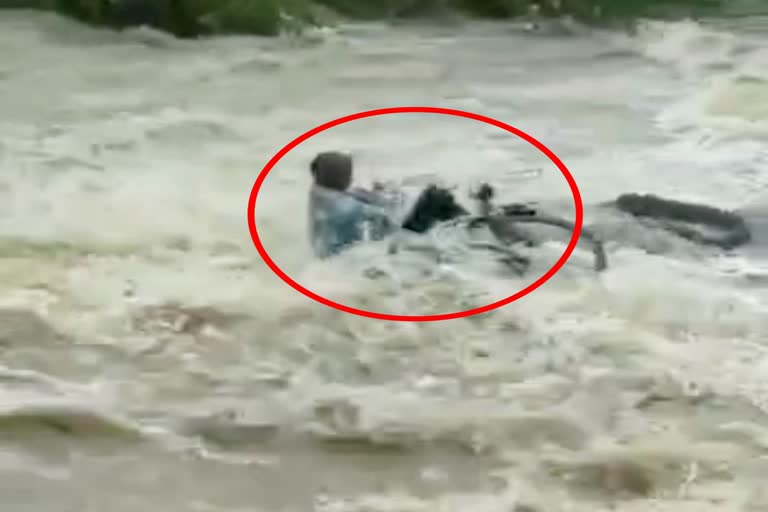 young man drowning in water