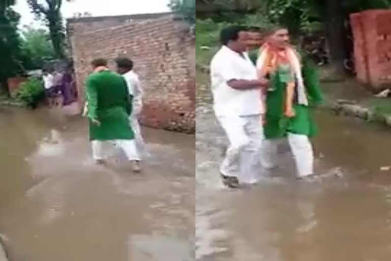 Villagers force BJP MLA to walk on water-logged road in Uttar Pradesh's Hapur  എംഎൽഎയെ മലിനജലത്തിലൂടെ നടത്തി നാനായിലെ ജനങ്ങൾ  നാനായി വില്ലേജ്  ഹാപൂർ  ബിജെപി എംഎൽഎ  കമൽ മാലിക്