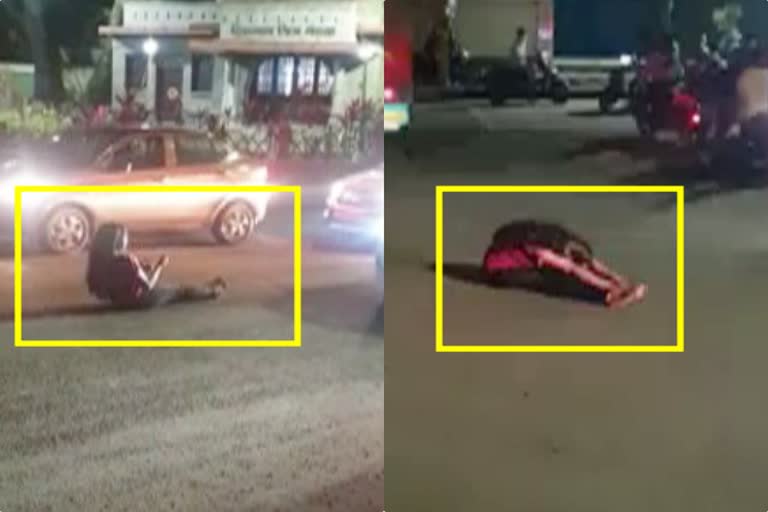 Drunken girl lying on the road