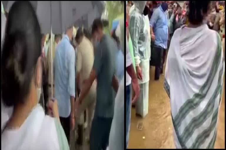 Mamata interacts with people standing in water