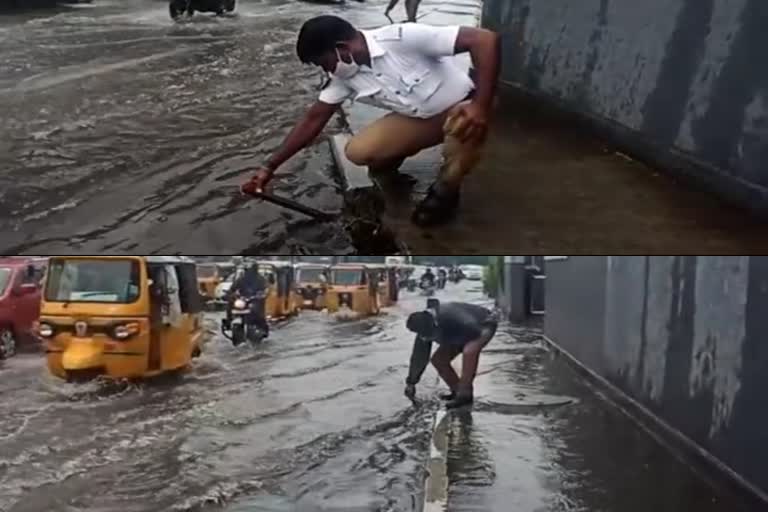 chennai traffic police, anna flyover, chennai traffic police clearing rain water
