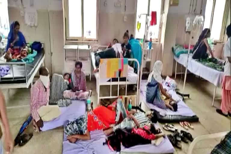 Treatment of children being done on the ground due to lack of beds