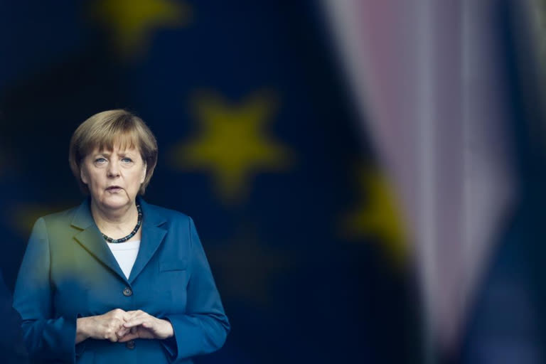Merkel steps down with legacy dominated by tackling crises
