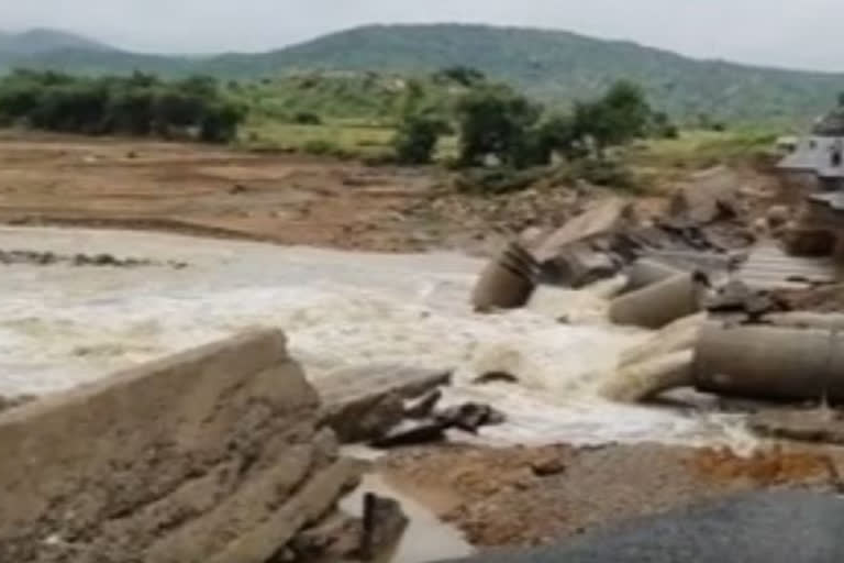 car washed away at kadiri and two died in the incident