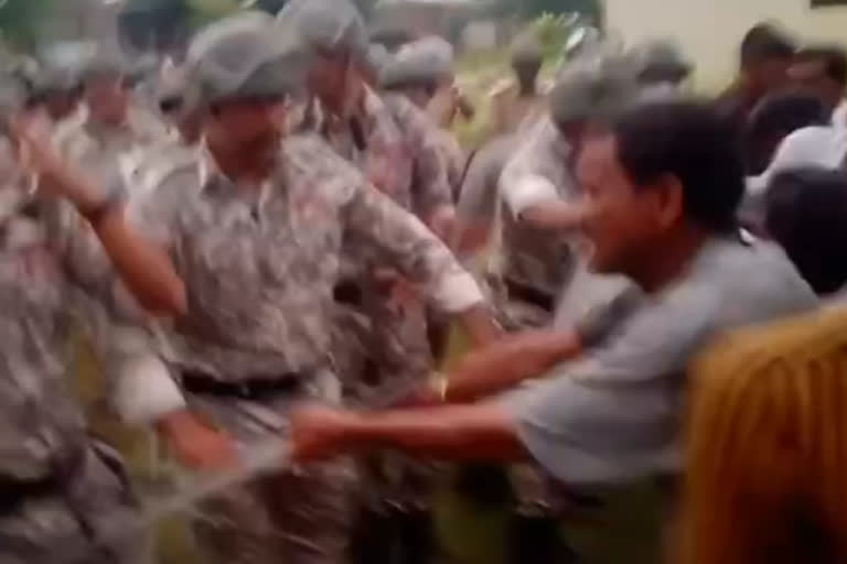 police villagers fight over statue