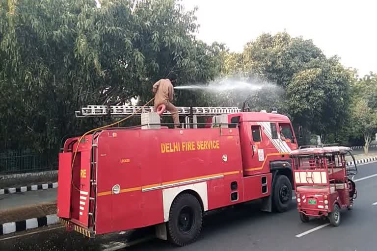 Spraying of water being done in Dwarka to remove dirt, soil, frozen on tree plants