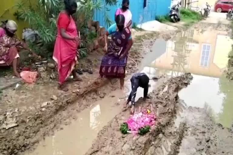 public protest by holding a funeral for the damaged road