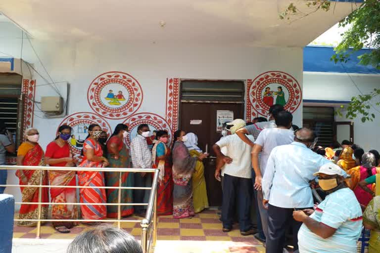 people crowd at vaccine centers