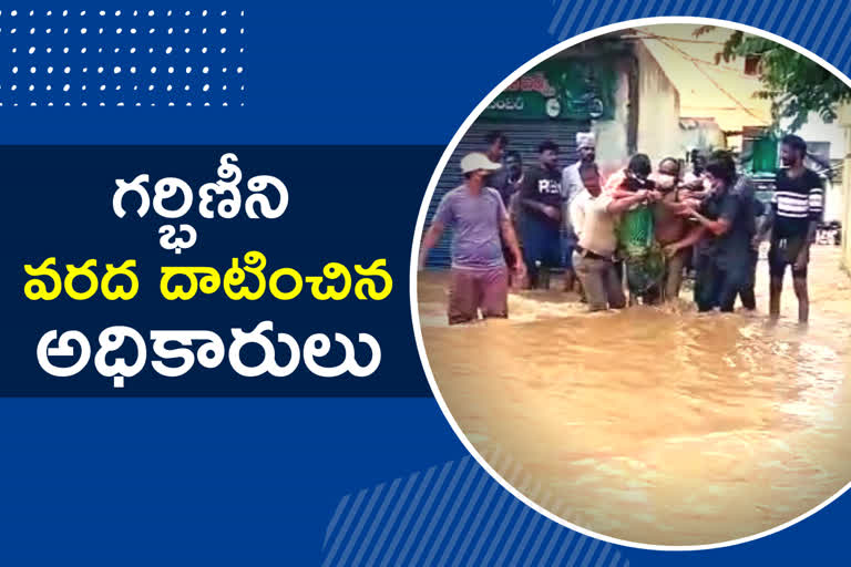Pregnant woman struck in flood at sircilla and Officers rescued with carrying on their hands