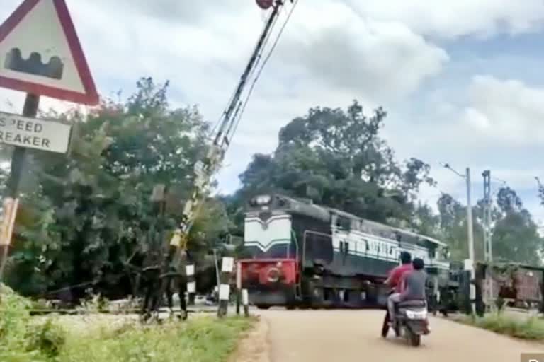 goods-train-passed-through-when-crossing-gate-was-opened-at-bangalore